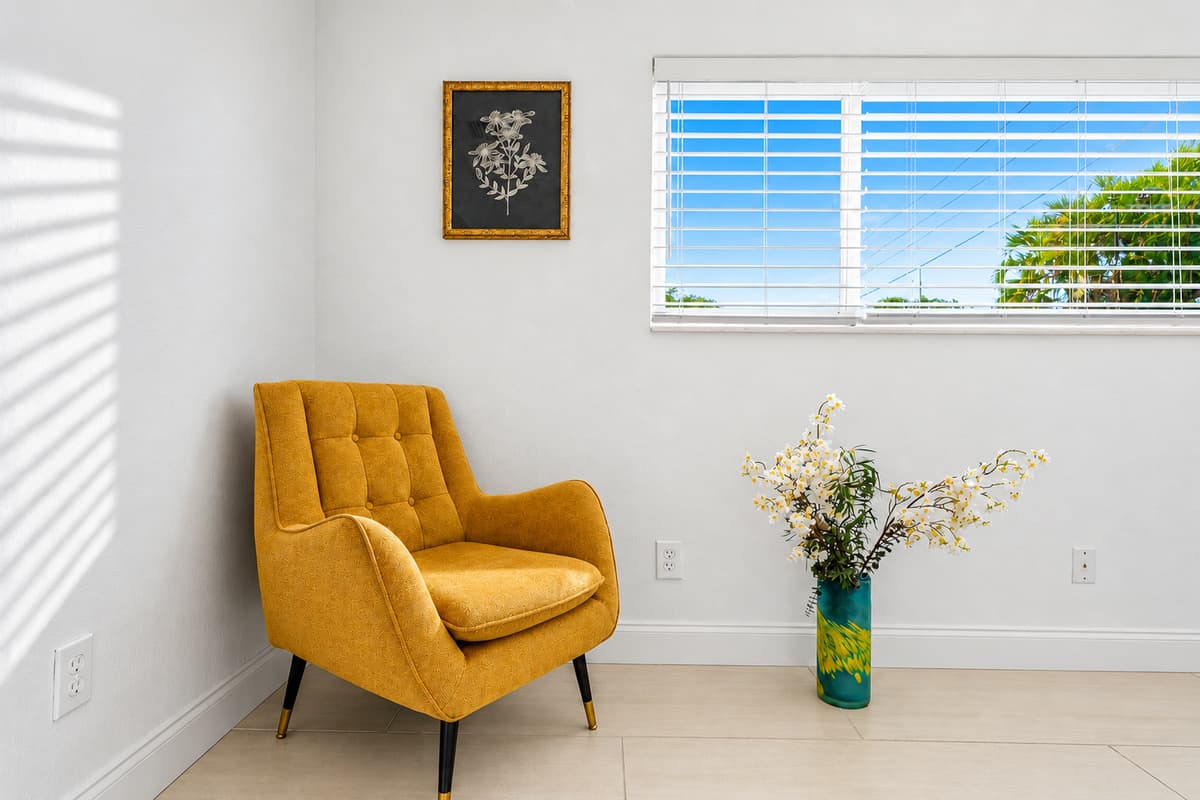 Comfortable reading nook with stylish accent chair and relaxing natural light.