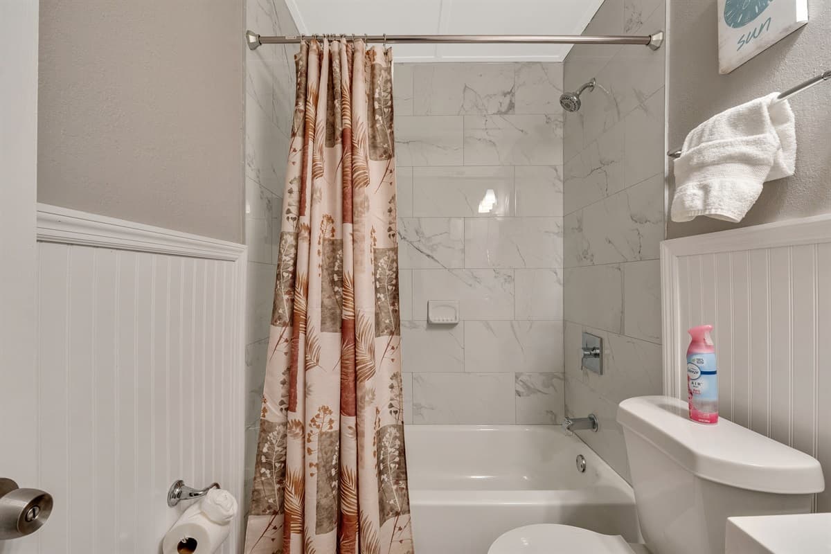 The ambiance whispers of opulence, with soft lighting casting a gentle glow on meticulously chosen fixtures and decor.