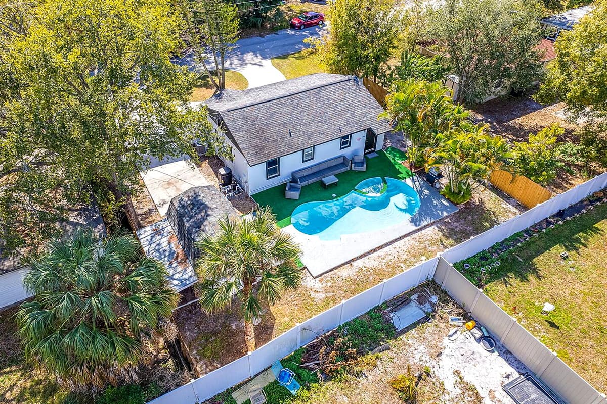 The aerial back side of the property showcasing our immaculate heated pool