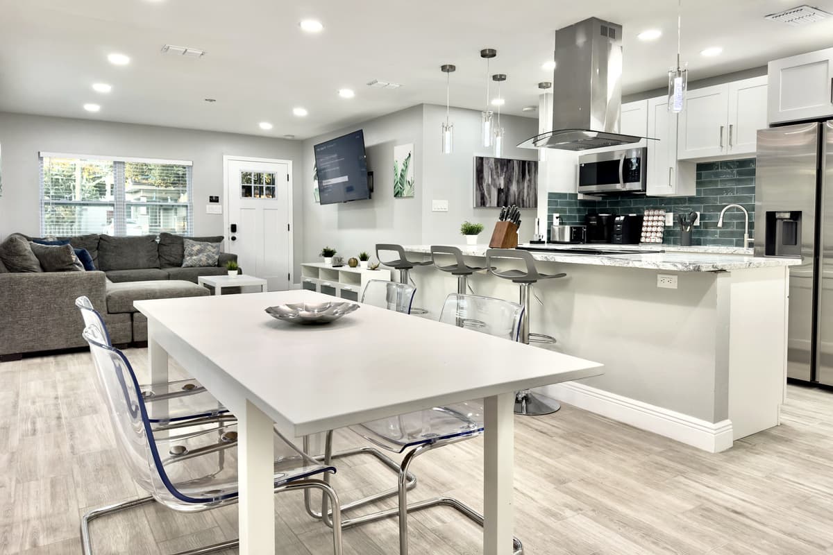 The dining table comfortably seats 4 guests, offering the perfect spot for everything from a hearty breakfast to an intimate dinner.