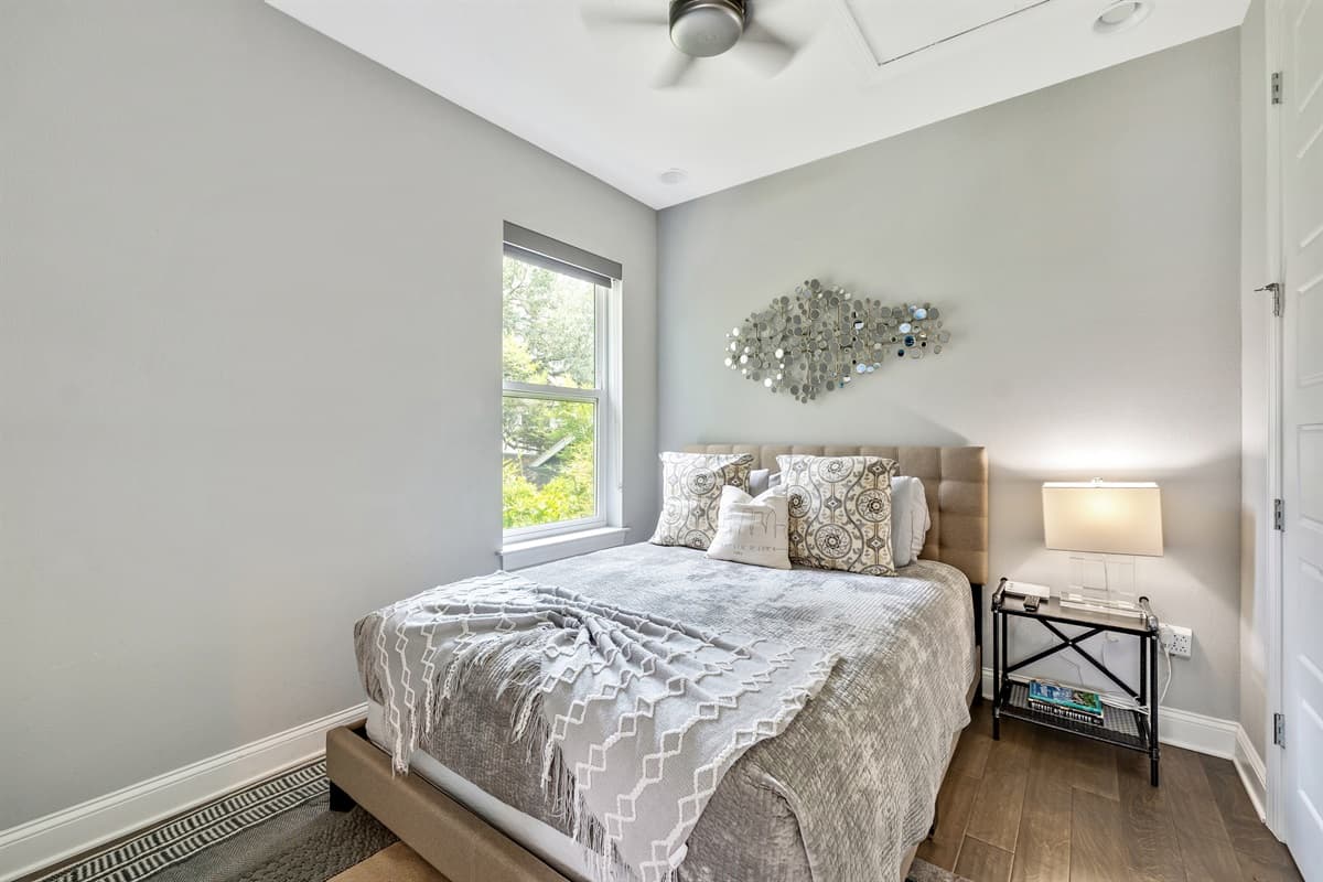 At the heart of the room is a comfortable queen-size bed, providing ample space for a restful night's sleep.