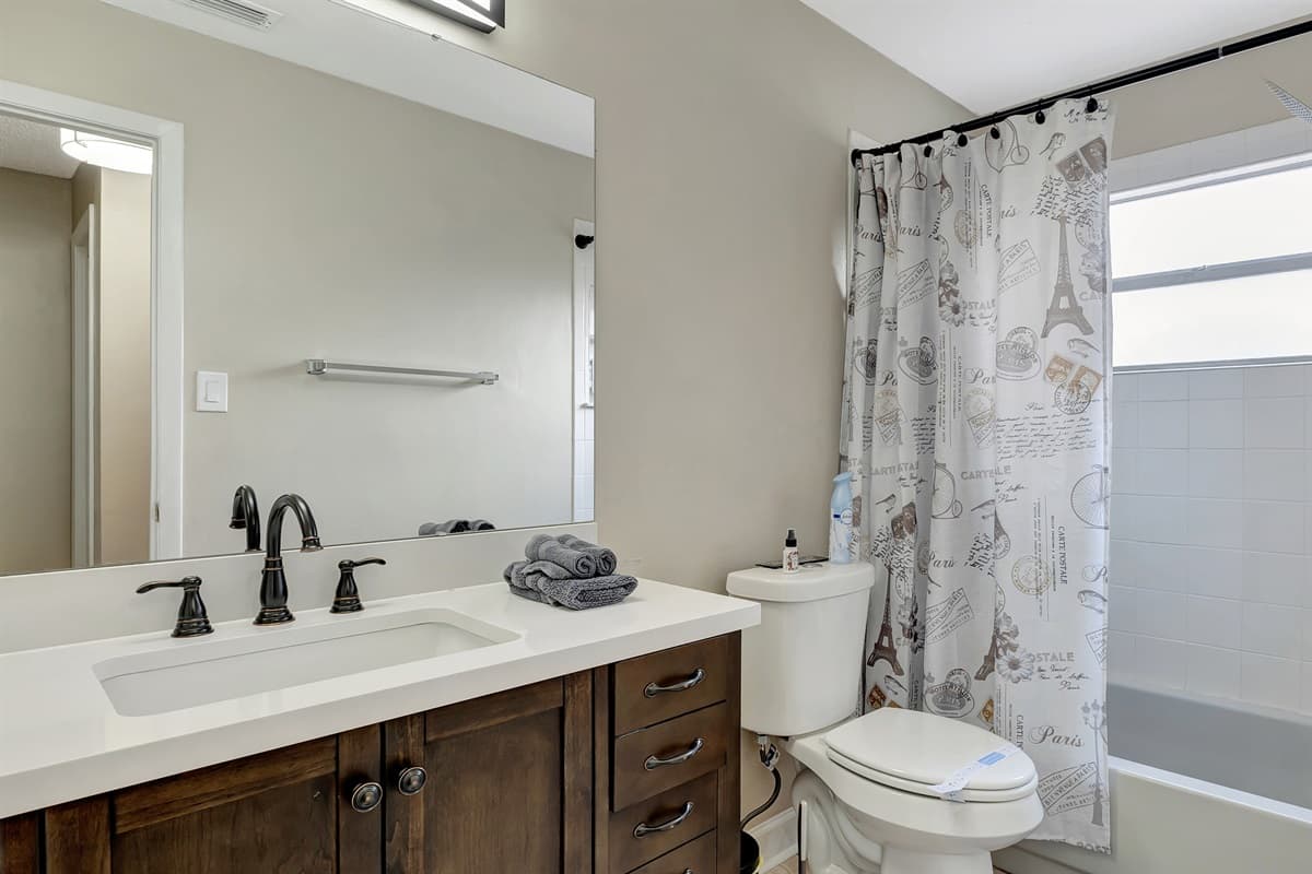 Our bathroom is a harmonious blend of luxury and functionality, featuring a tub and shower combination for the perfect bath-time balance.