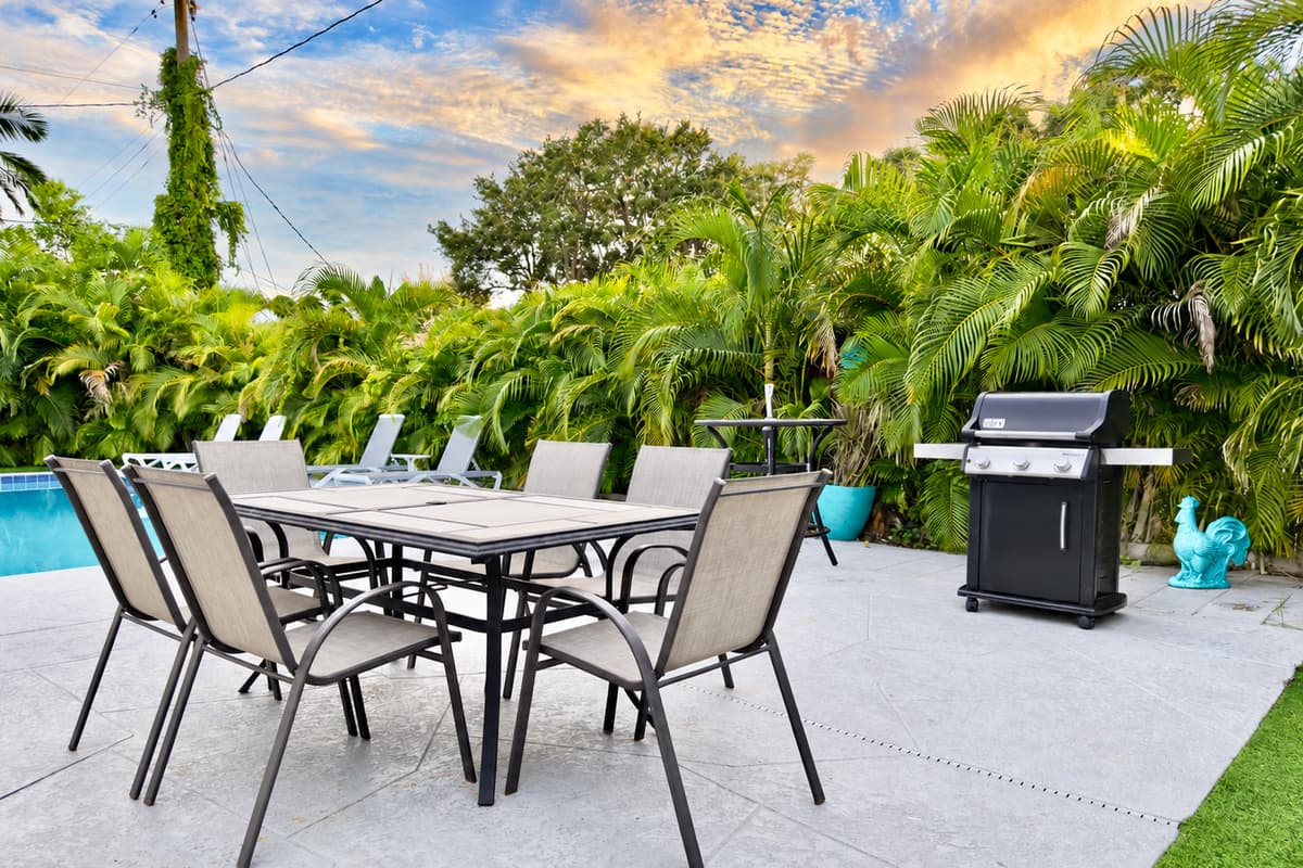 The home’s private pool deck is surrounded by lush greenery, creating a serene and private escape.