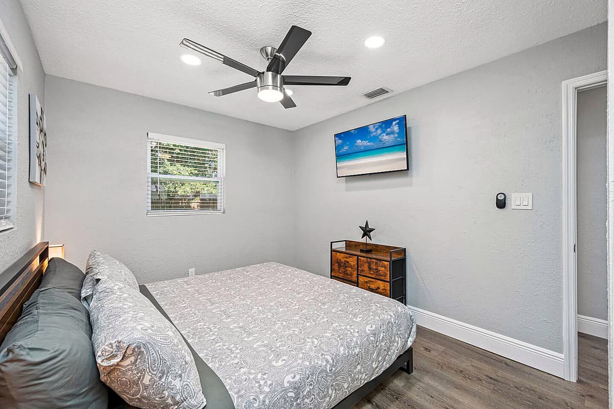 Sleep safe and sound on the comfort of your home away from home. This comfortable bedroom has a queen sized bed, smart TV and drawers for storage!