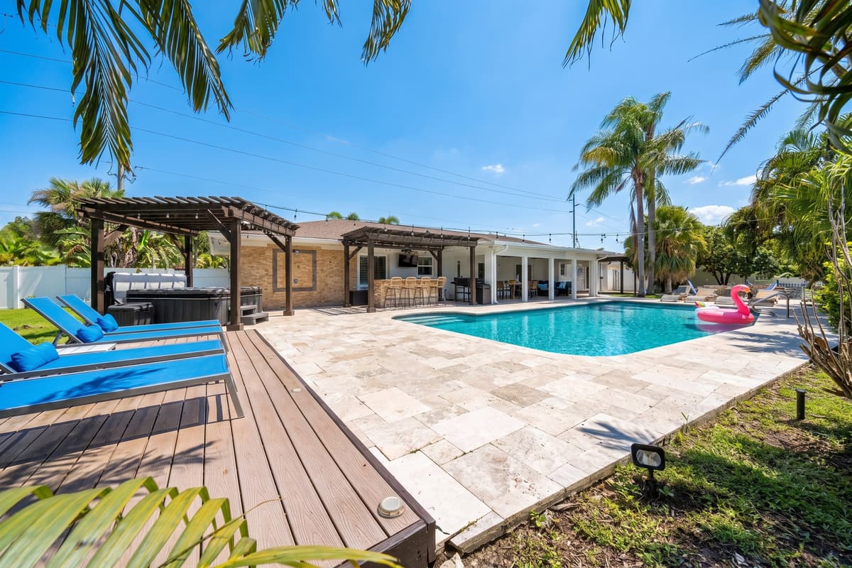 One sweeping view captures it all, private hot tub, sun deck, sparkling pool and outdoor bar, a backyard built for unforgettable group getaways