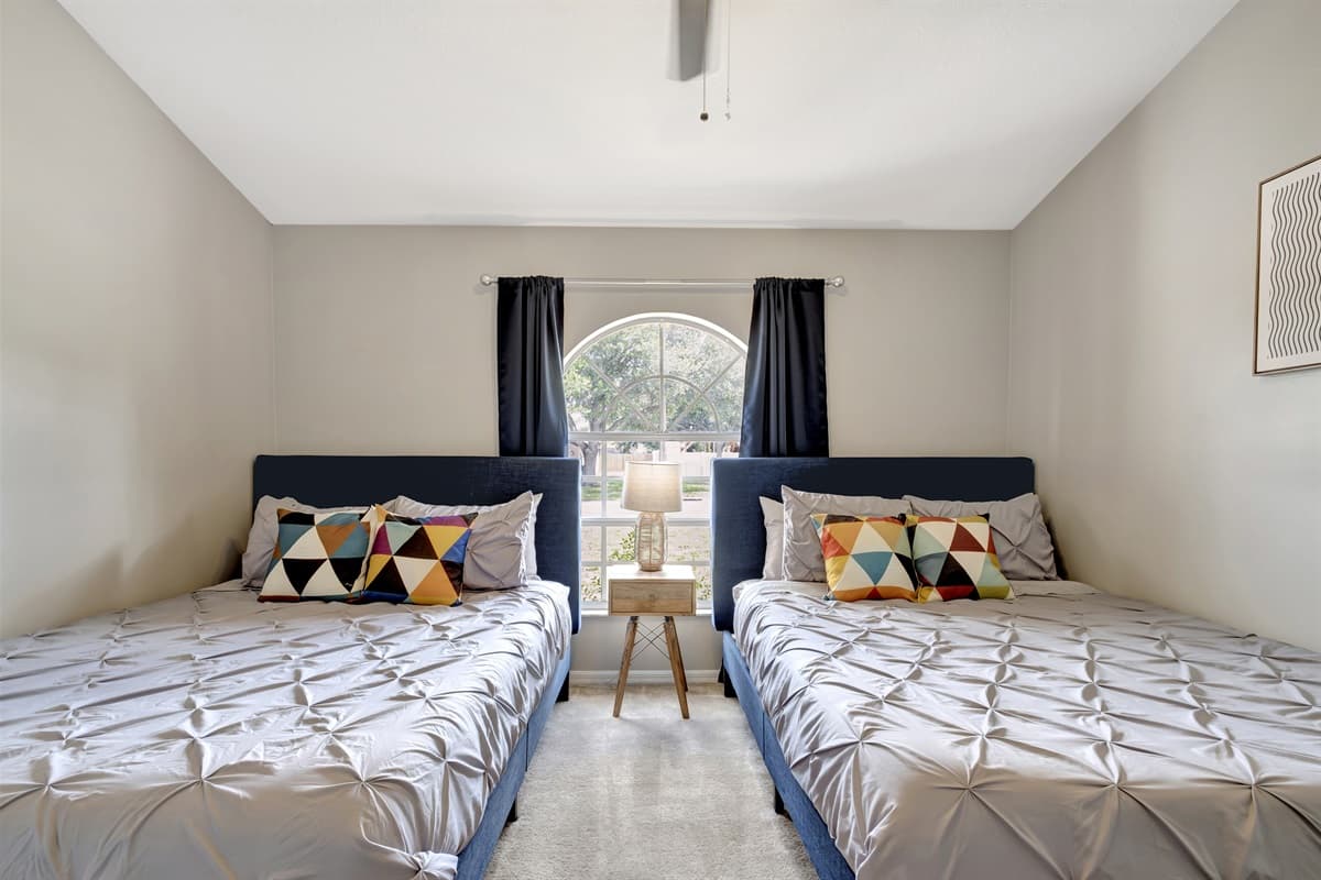 Indulge in the comfort of our queen-size beds, enjoy the natural beauty streaming through the large window, and make use of the thoughtfully designed amenities to create your ideal retreat.