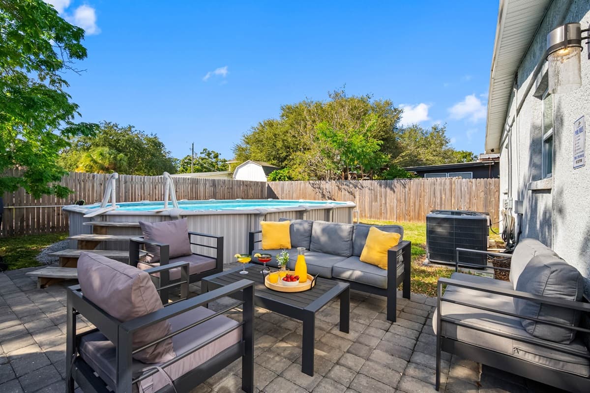 Comfortable seating, soft lighting, and lush greenery create a serene atmosphere.