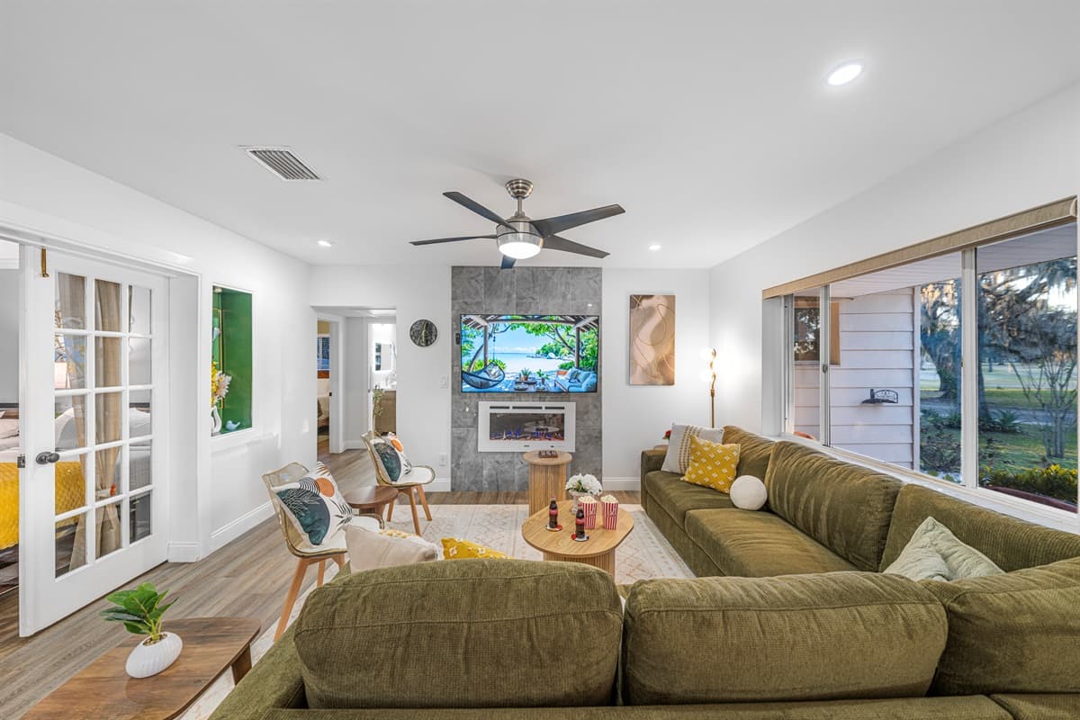 This beautifully appointed living room invites you to relax with its spacious layout, soft textures, and thoughtfully curated furnishings.