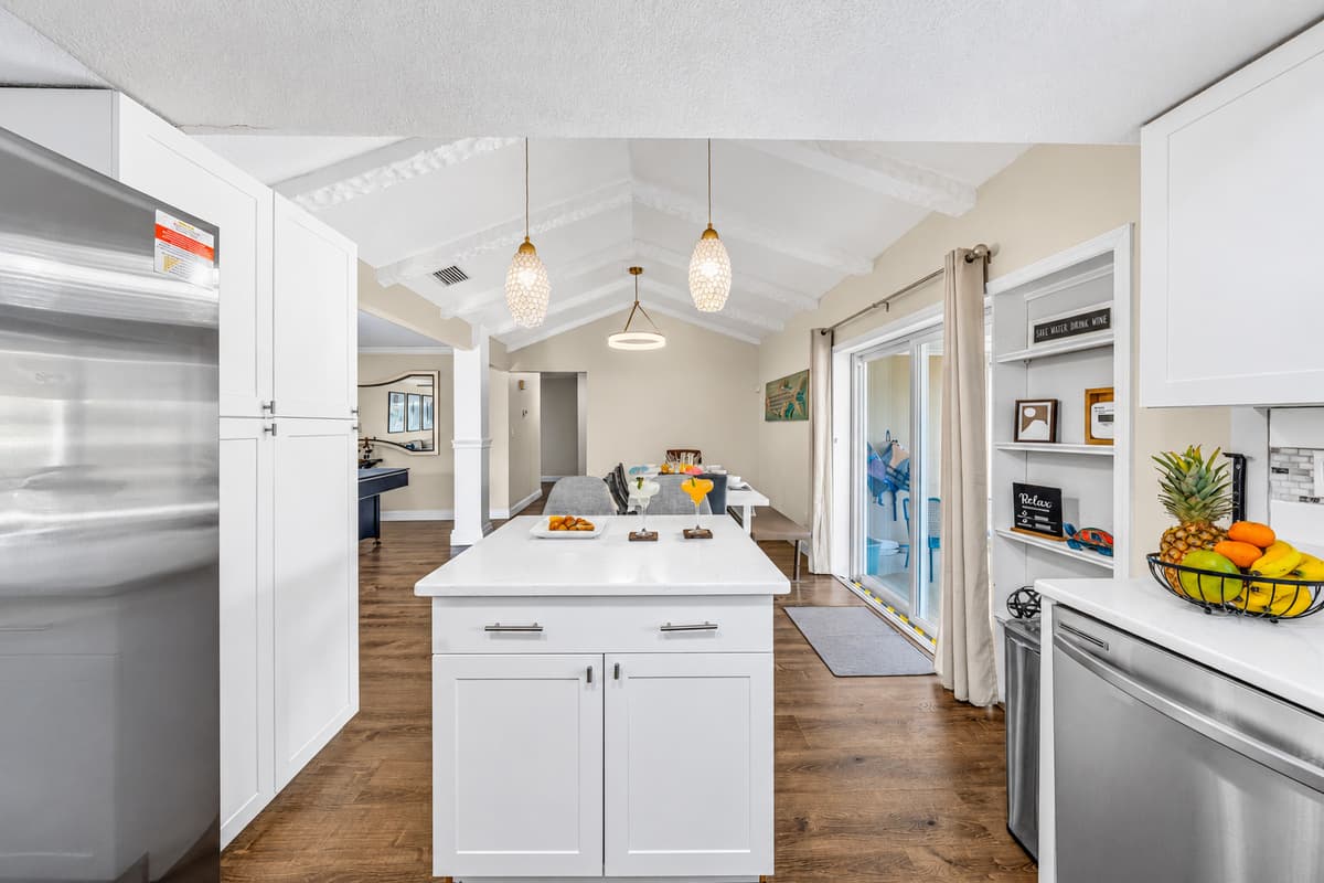 Fully equipped kitchen featuring stainless steel appliances and generous counter space.