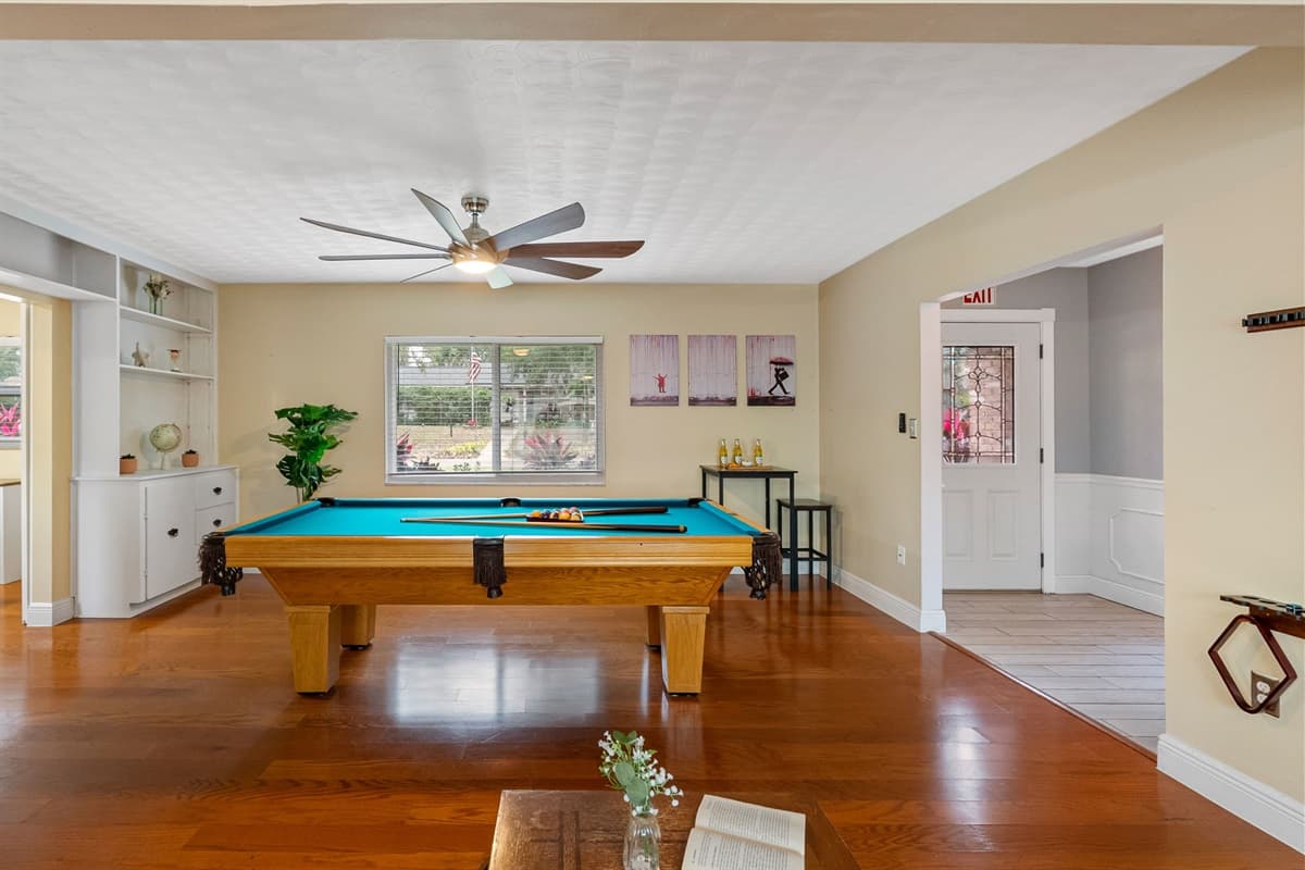 A dedicated game area with a full-size pool table and plenty of room to play.