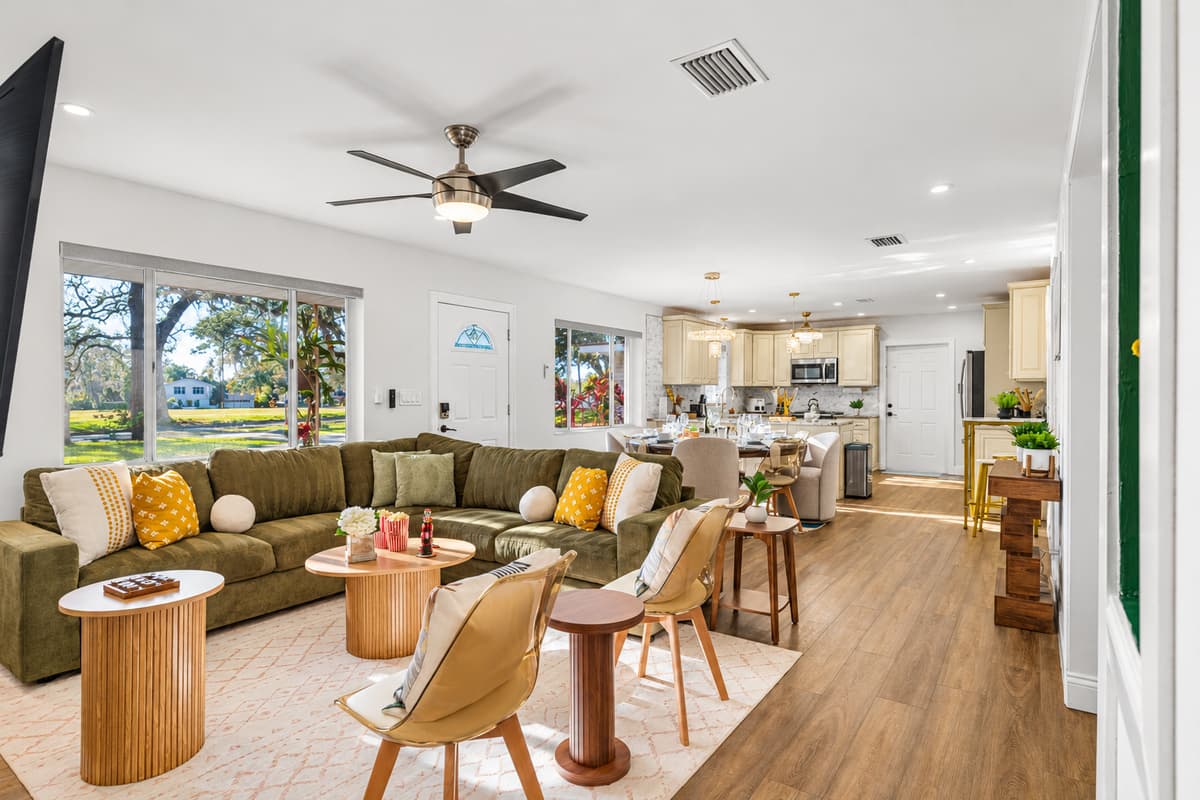 Designed for both style and comfort, this living room offers plenty of seating, tasteful décor, and a bright, airy feel throughout.