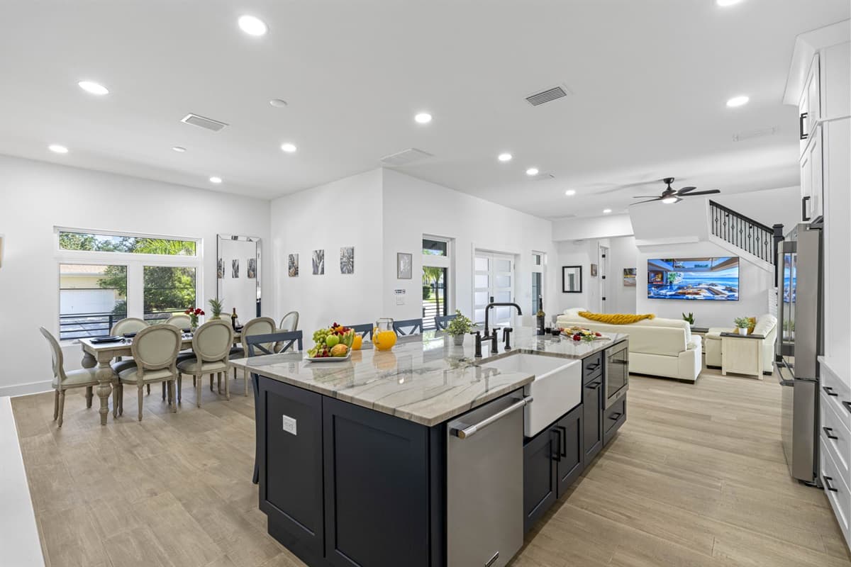 The large dining counter is designed to be a central gathering place, offering plenty of space for everyone to come together and enjoy shared meals.
