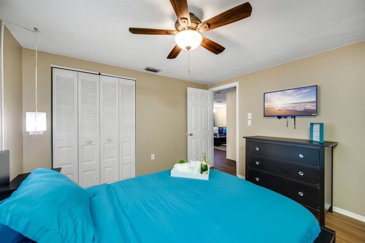 The beautiful room has a queen-size bed, drawers, and its own smartTV. Who wouldn't want a comfortable room to rest in after a long day of activities with family?