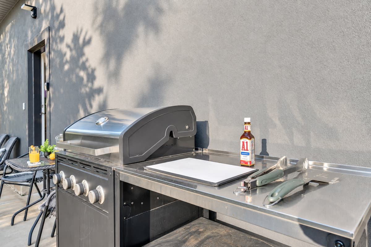Full-size grill, real prep space — cook for twenty without leaving the shade.