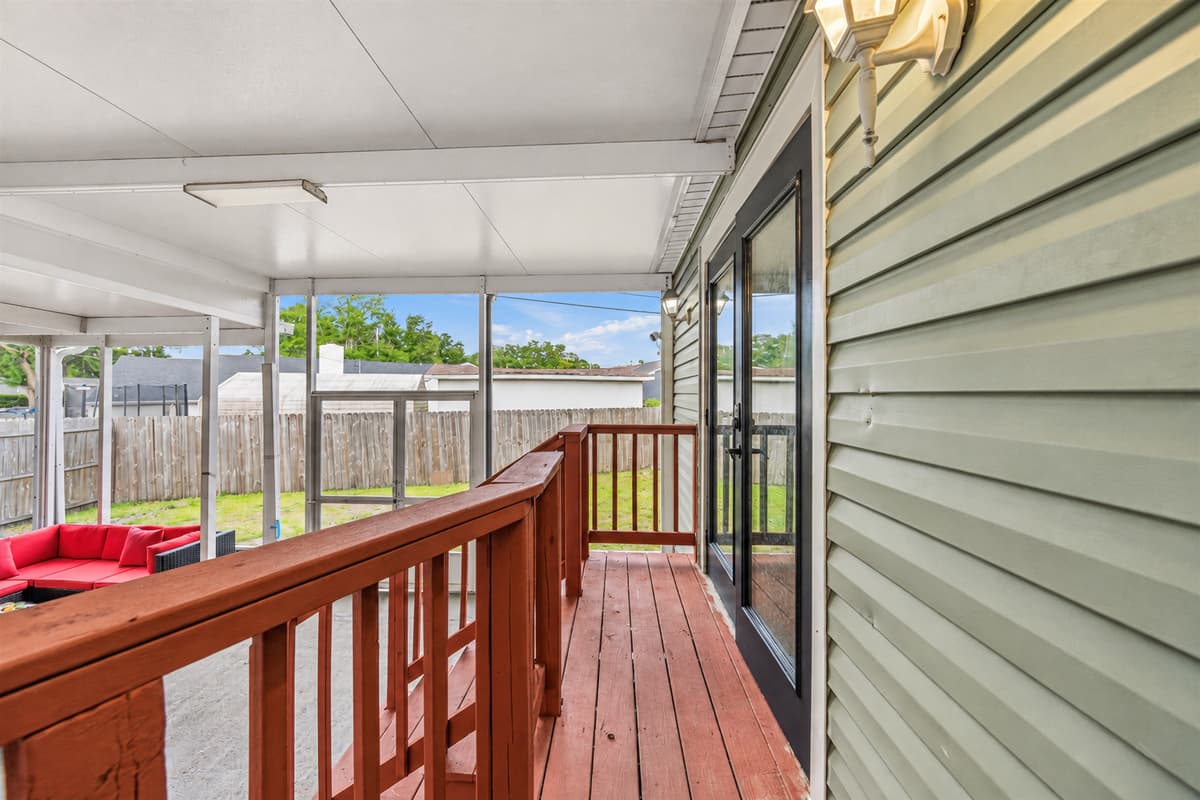 Walkway along the screened patio offering privacy and seamless indoor-outdoor flow.