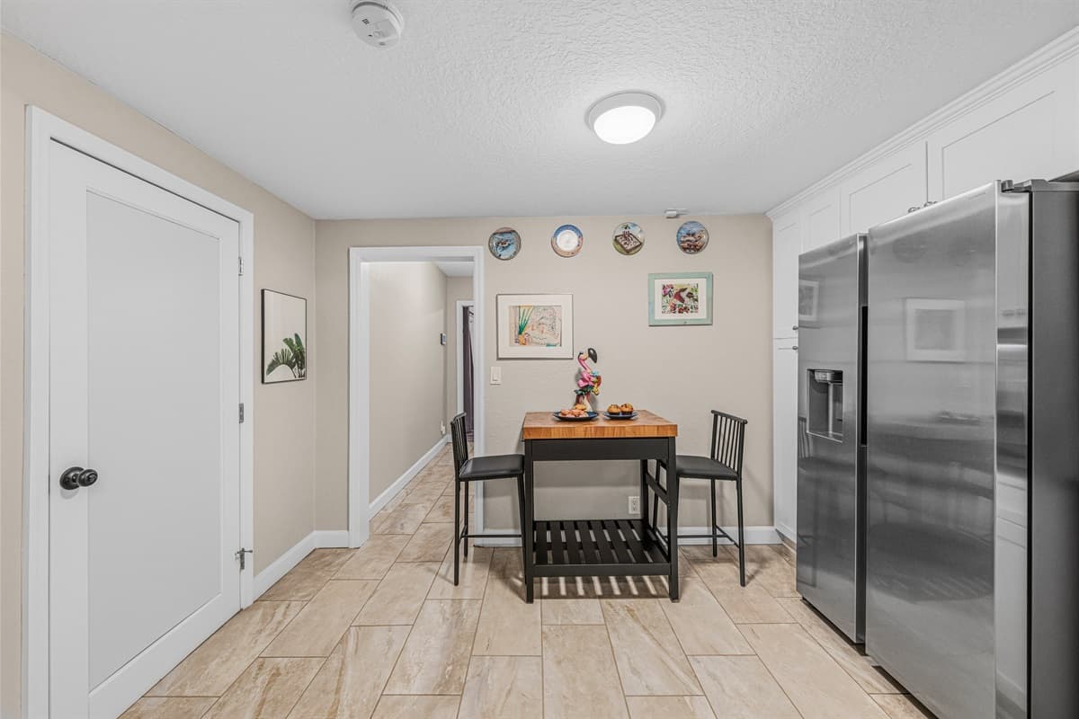 Cozy breakfast nook with seating for casual meals, coffee, or quick bites.