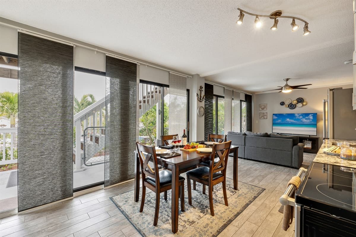 The dining space is strategically positioned in close proximity to the kitchen, facilitating effortless access and smooth interaction between the cooking and dining areas.