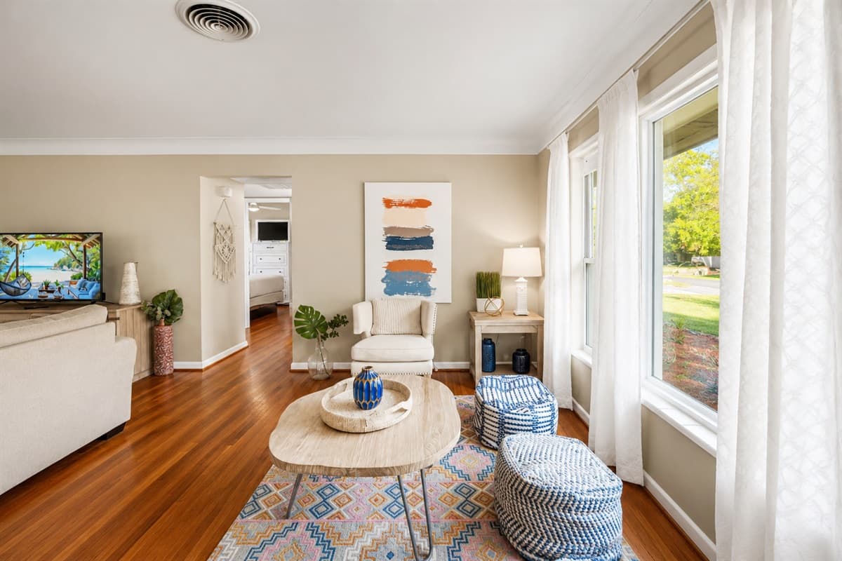 Open living space featuring comfortable seating, breakfast bar access, and spacious common areas.