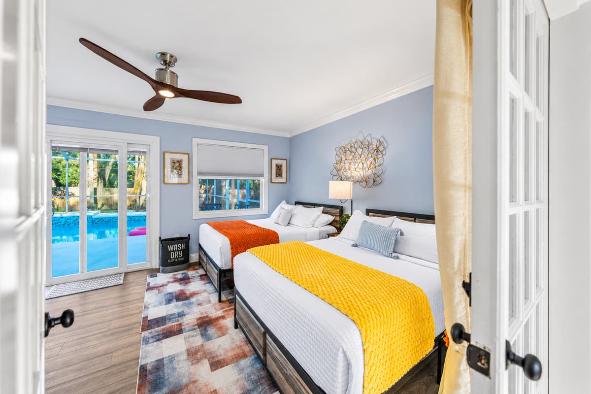 Perfect for group stays, this bedroom includes two double beds and a relaxed, airy layout.