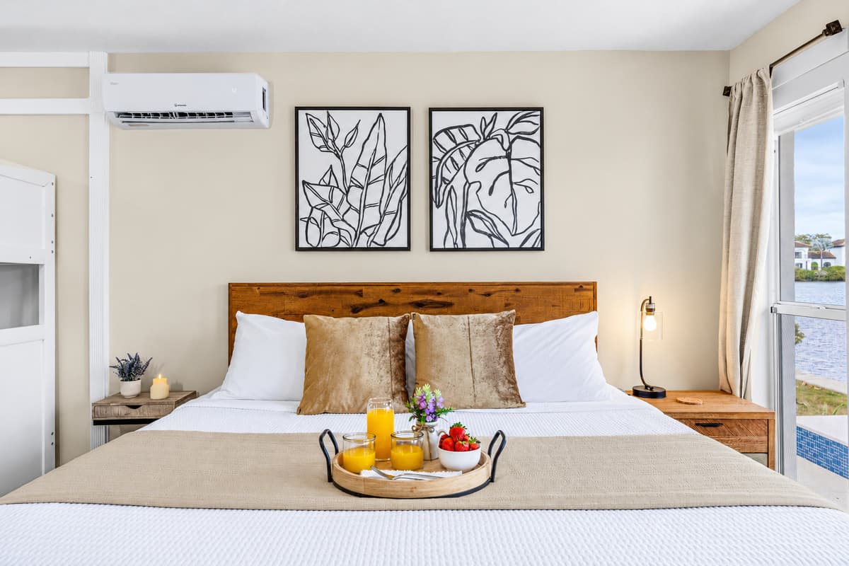 Comfortable king bedroom with stylish décor and convenient bunk beds for kids.