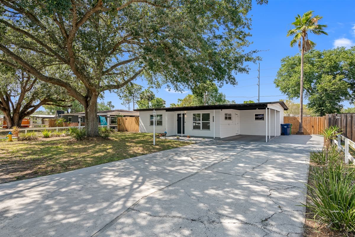 The front yard is a tranquil oasis with perfectly manicured grass that feels like walking on a soft, fluffy cloud.