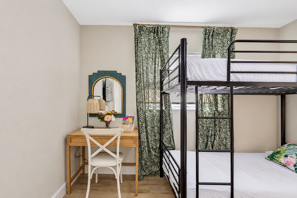 In this bedroom, flexibility and thoughtful design converge to create a welcoming environment that adapts to the unique needs of each guest.
