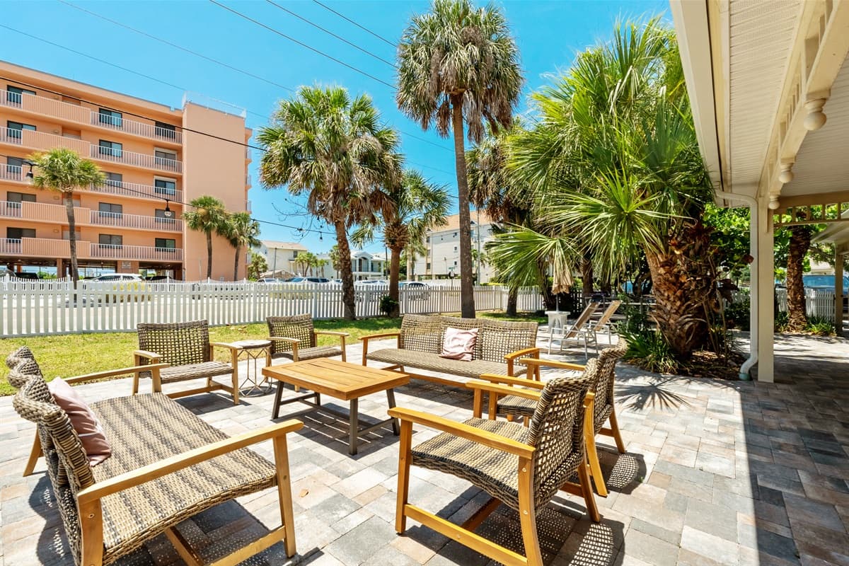 As you step into the outdoor common area, you are greeted by an array of comfortable seating options.