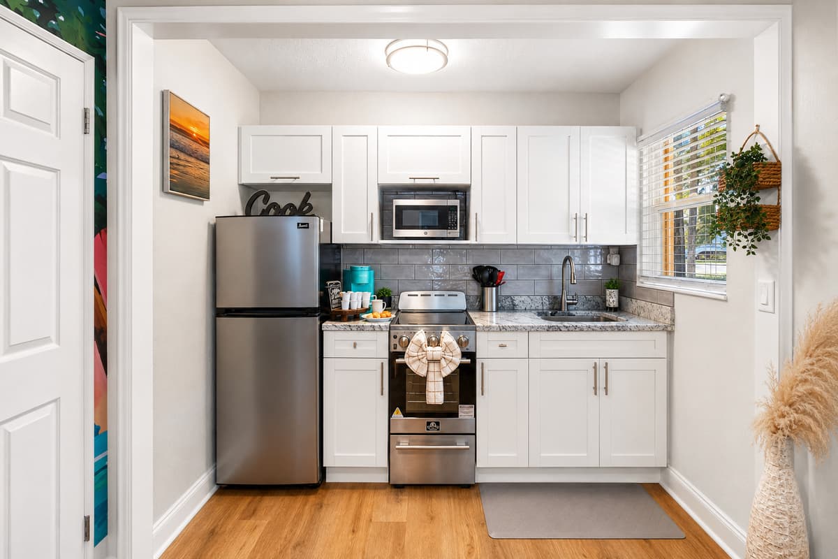 Cook with ease in the modern kitchen featuring full-size appliances, cookware, ample counter space, and everything you need for a comfortable stay.