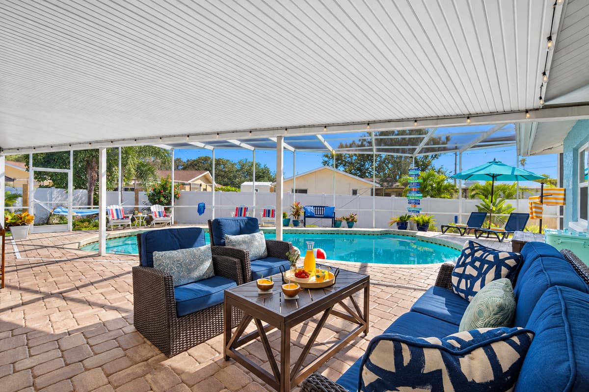 Spacious, inviting, and beautifully lit, this screened pool area is perfect for family fun, afternoon swims, or dining al fresco by the water.