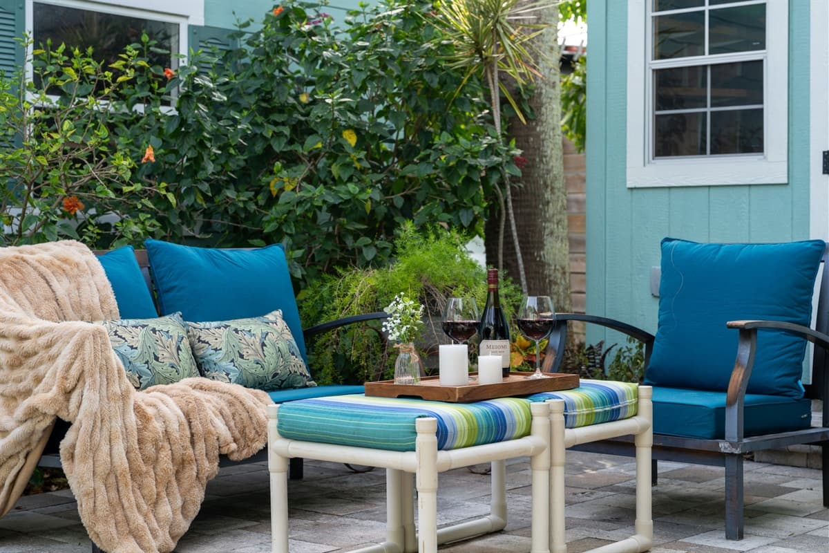Colorful cushioned chairs and a cozy lounge setup create the perfect spot for enjoying the Florida sunshine.