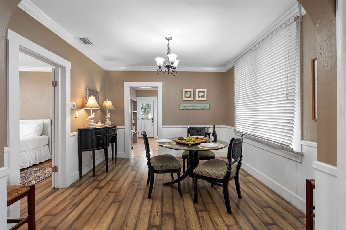 The decor in the dining area is thoughtfully chosen to complement the rest of the home, with tasteful touches that add to the space's charm.