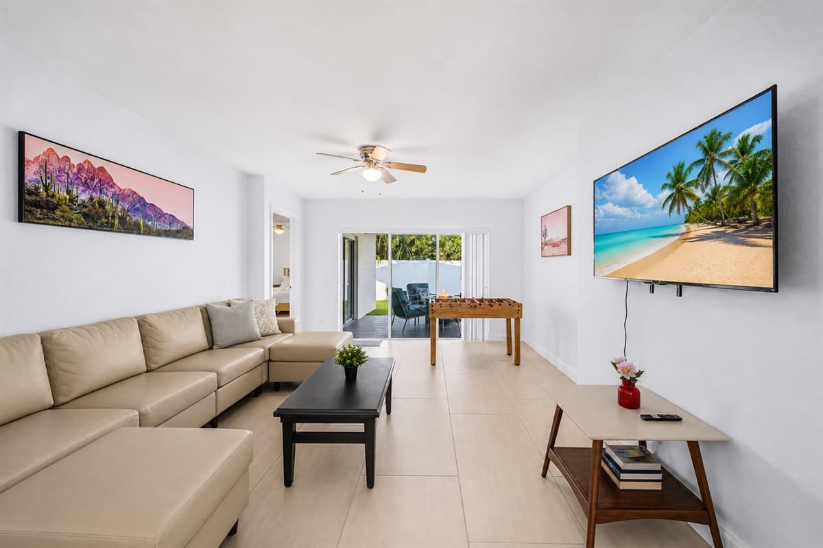 Spacious living area with open layout, comfortable seating, and entertainment amenities.