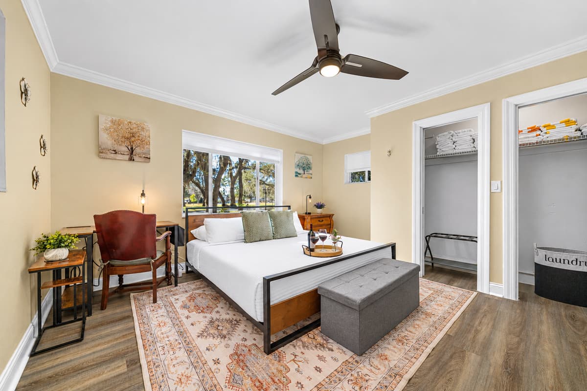 This serene bedroom features a comfortable king-size bed, soft linens, and calming décor—perfect for restful nights and relaxed mornings.