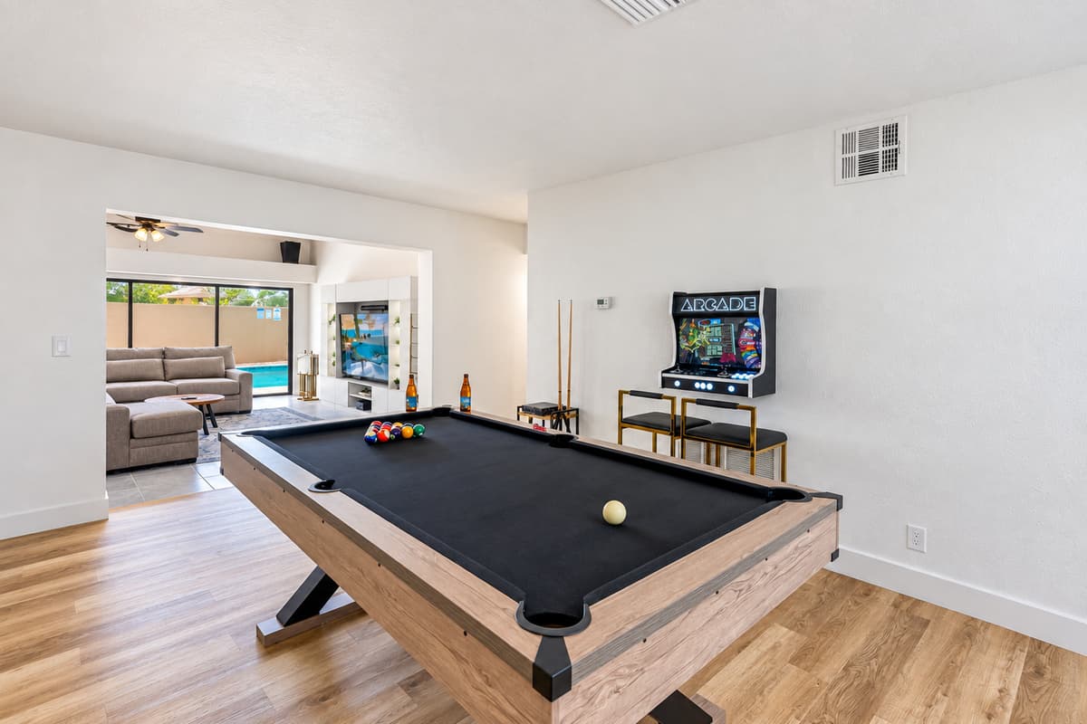Cue up your next match! This bright and modern game room delivers classic entertainment with a stylish twist.