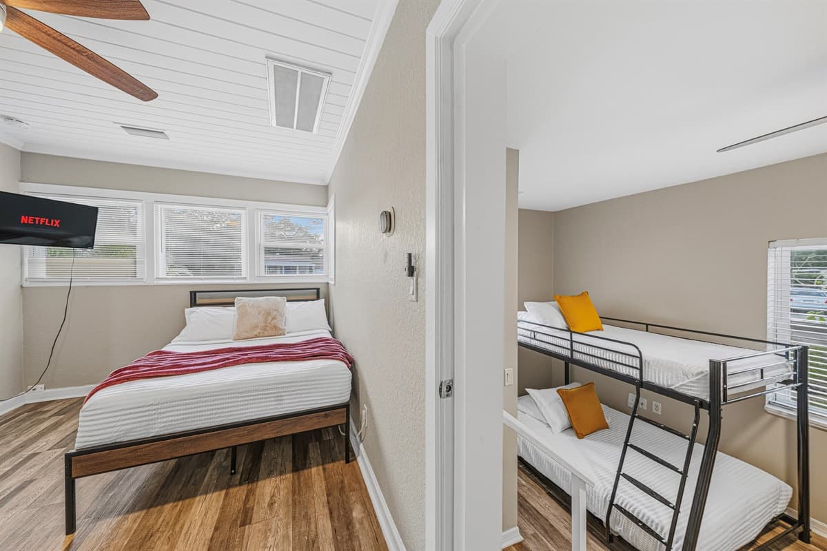 Bedrooms 3 and 4 are connected. To access Bedroom 4, you’ll need to pass through Bedroom 3. However, both bedrooms do have their own doors for privacy.