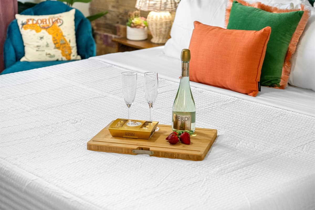 The bedroom features a luxurious king-size bed, adorned with premium linens.