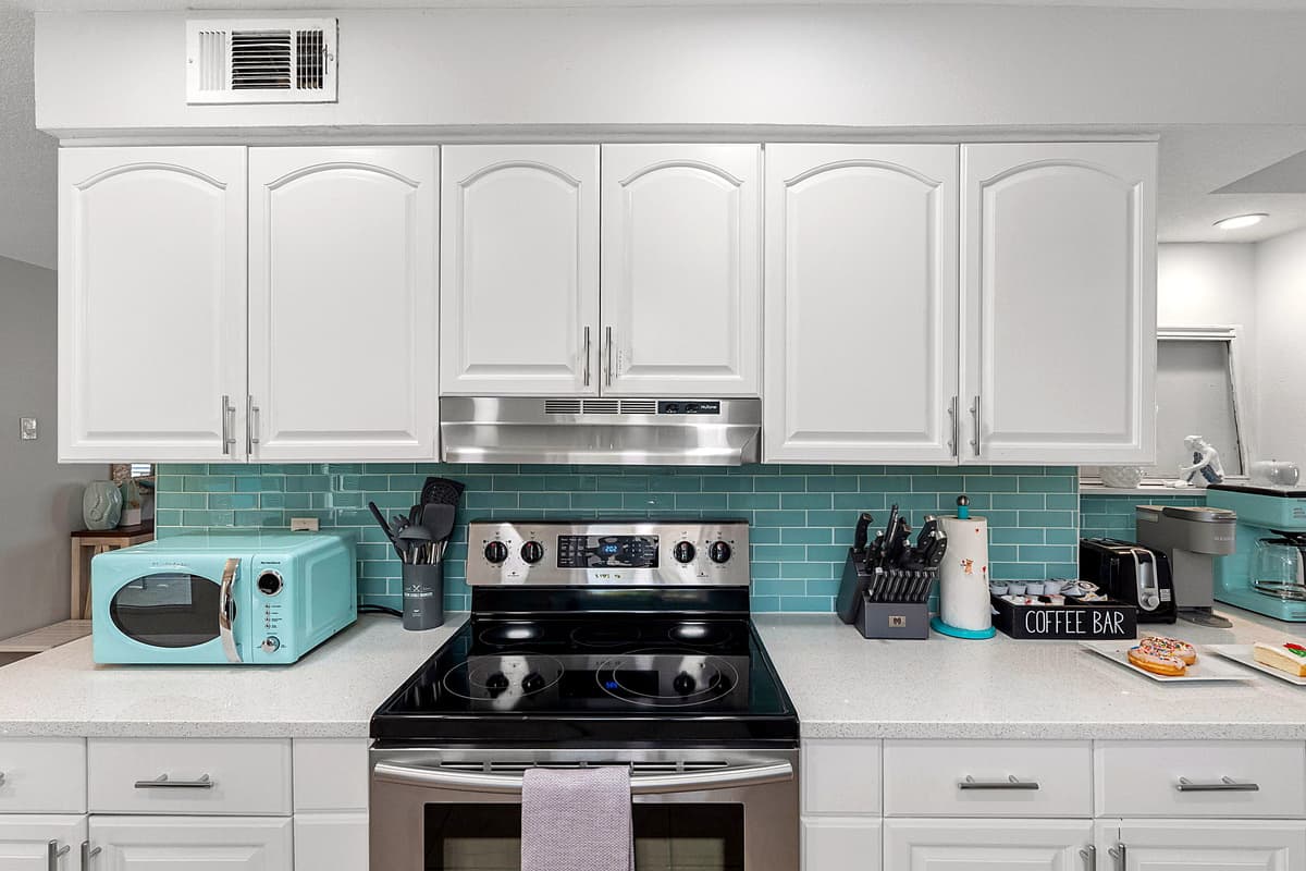 Every detail, from the coastal color scheme to the thoughtfully placed amenities, makes this kitchen a pleasant, inviting space.