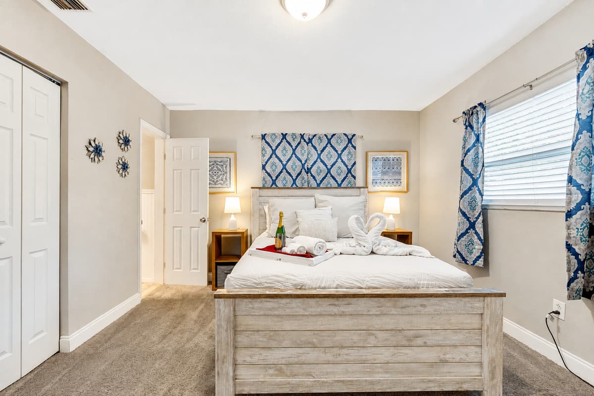 A regal queen-size bed takes center stage, inviting you to surrender to its embrace after a day of adventures or a night of blissful dreams.