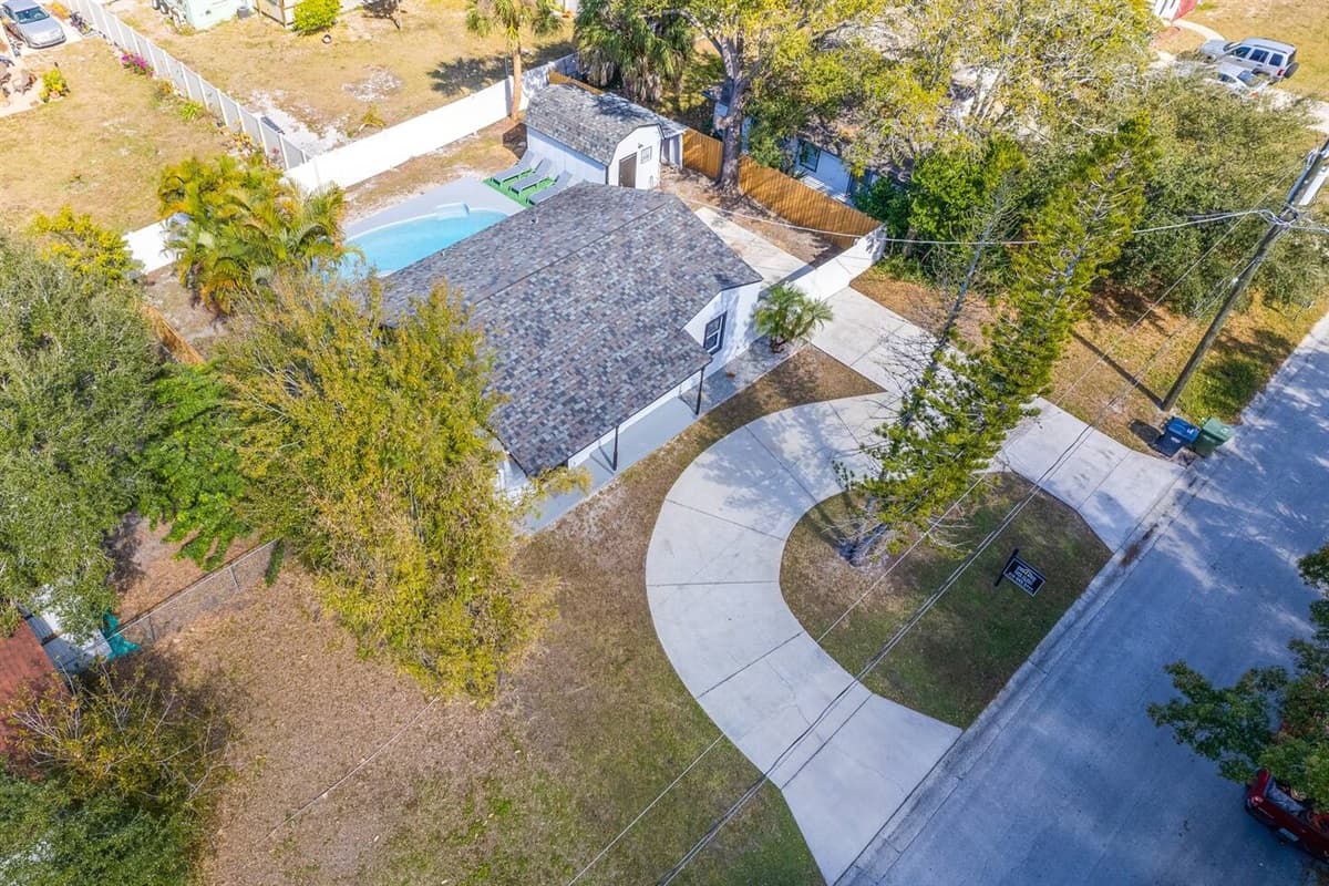 Aerial front view of the house showcasing the lovely driveway where you can park