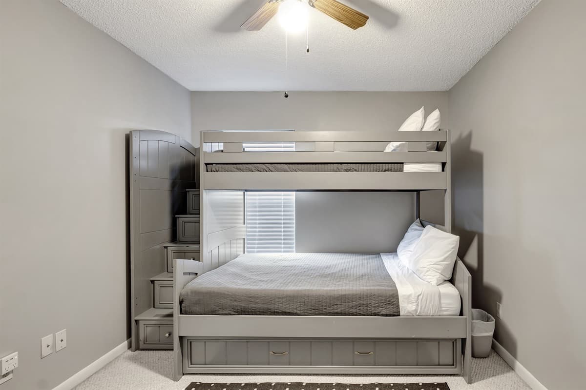 Step into the playful charm of Bedroom 4, where a delightful cozy bunk bed steals the spotlight.