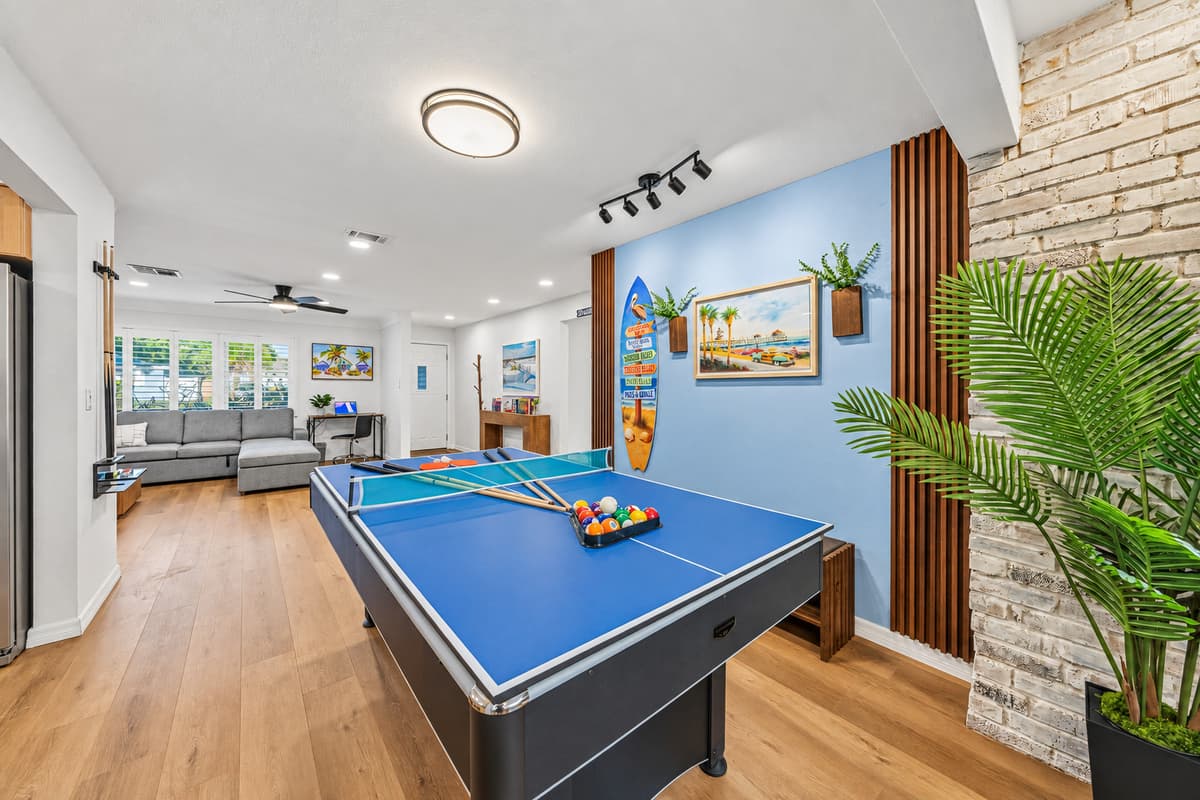 Open entertainment space connecting the game area to the main living room—perfect for socializing 