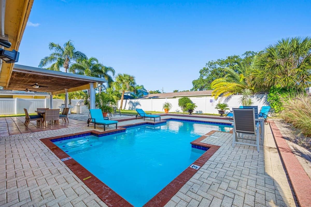 A fully fenced backyard with an amazing heated salt pool where you, family and friends can have fun and bond. Lounge chairs where you could relax. 