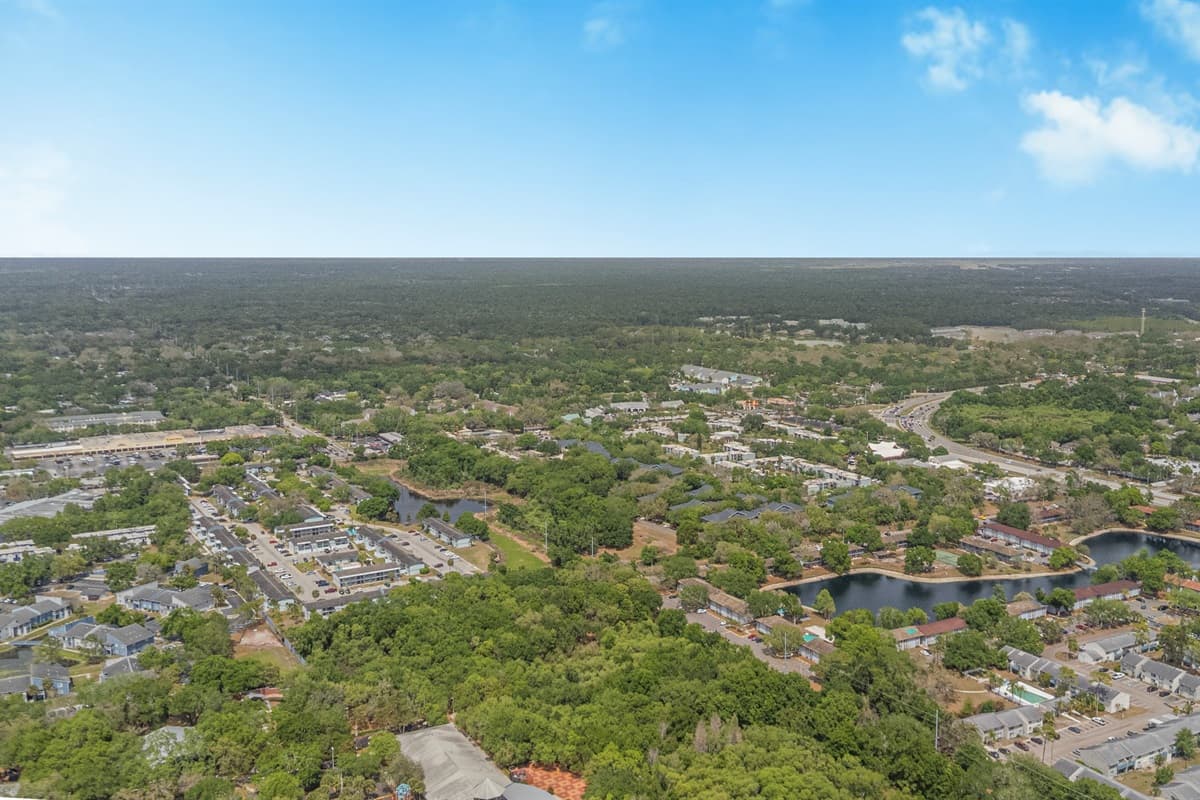 Nestled in a lush, tree-lined neighborhood dotted with scenic lakes — the kind of setting that makes you forget you're in the city.