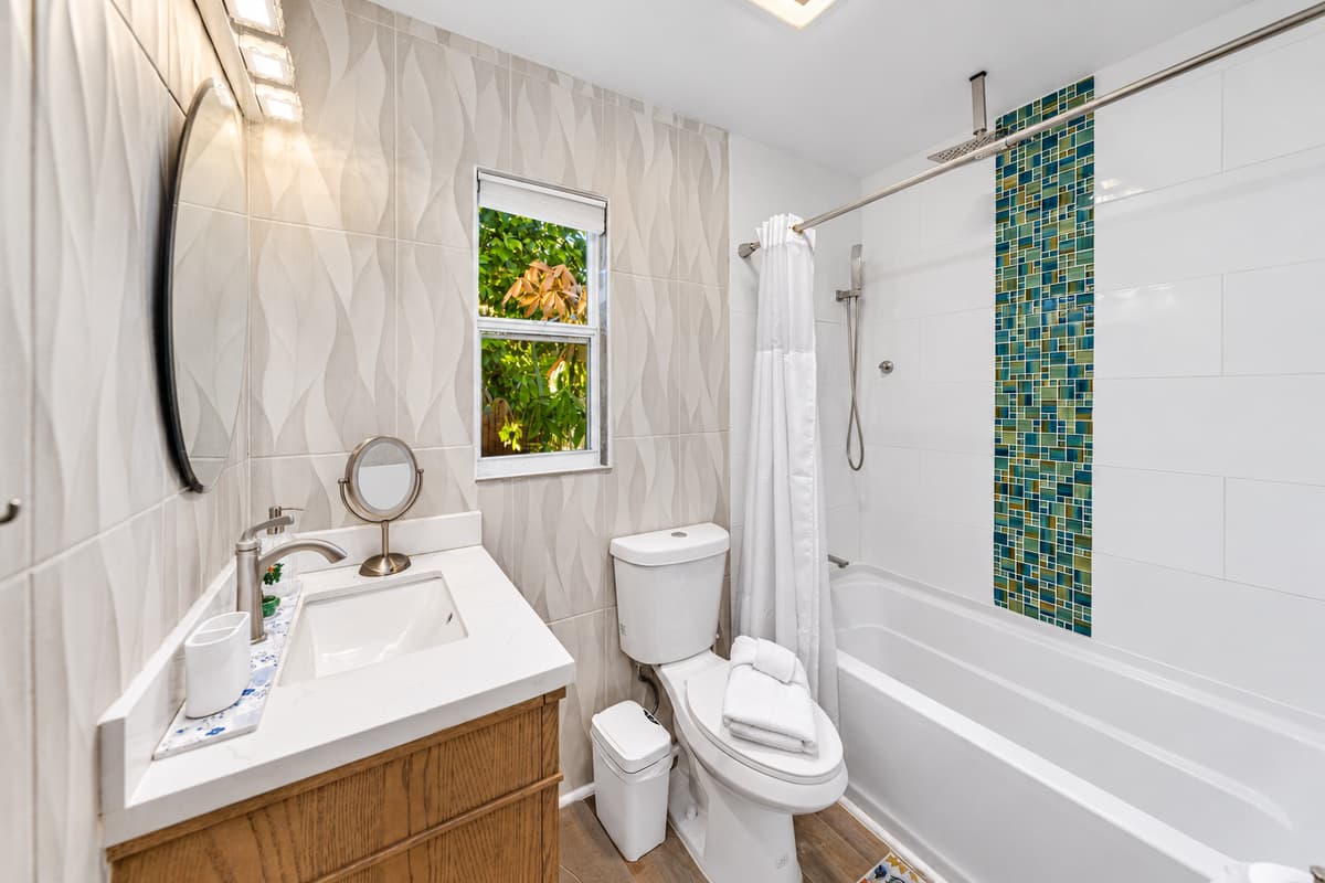 This bright, modern bathroom features clean finishes, stylish tilework, and a fresh, spa-like feel.