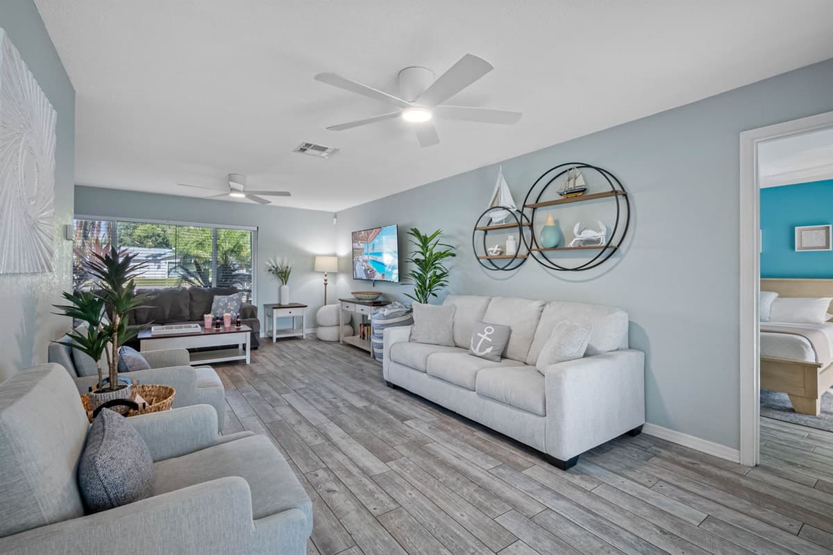 Calming blue tones and nautical accents create a serene coastal vibe throughout this inviting space.