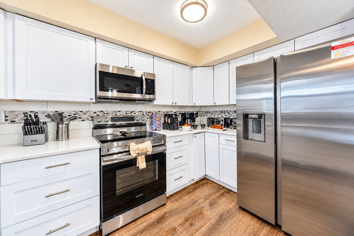 Cook with ease in the well-stocked kitchen with modern appliances and ample storage.