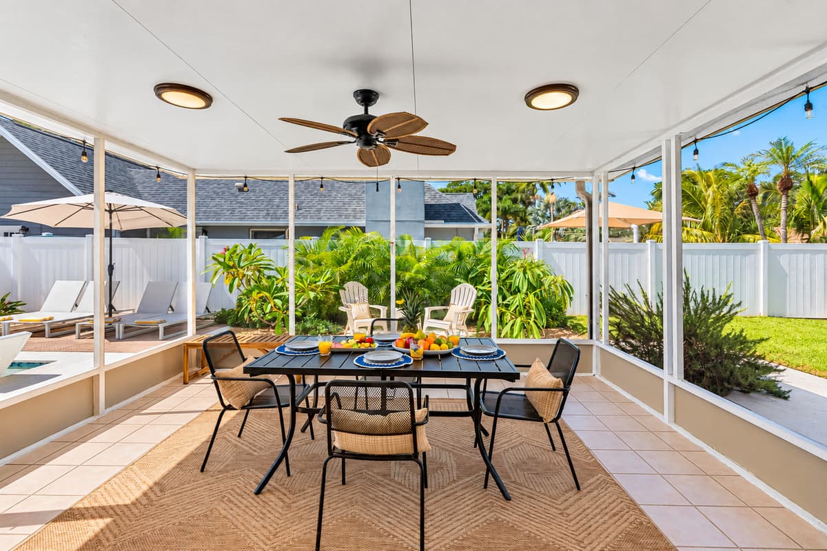 With chic patio furniture, lush greenery, and a crystal-clear heated pool, you won’t want to leave this backyard.