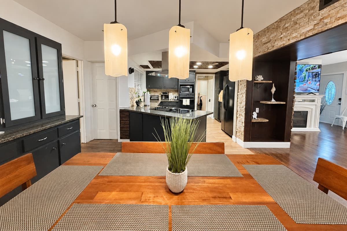 This warm, wood-toned dining space invites you to linger longer—perfect for enjoying coffee in the morning or wine at night.