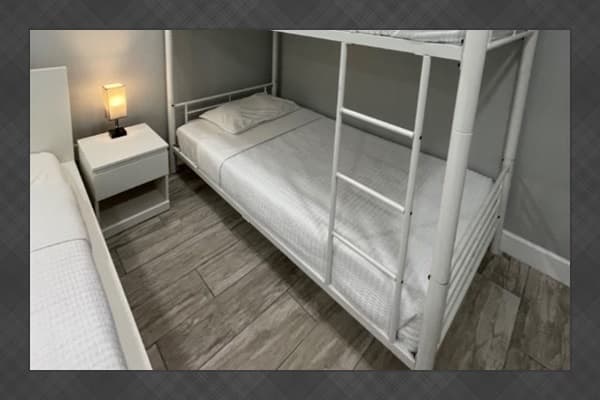 Designed to suit groups of all sizes, this room offers a queen bed paired with a twin-over-full bunk bed, providing flexibility and comfort. *Updated photos will be added soon!