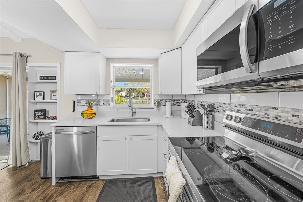 Modern kitchen layout with premium appliances and an open flow into the dining area.